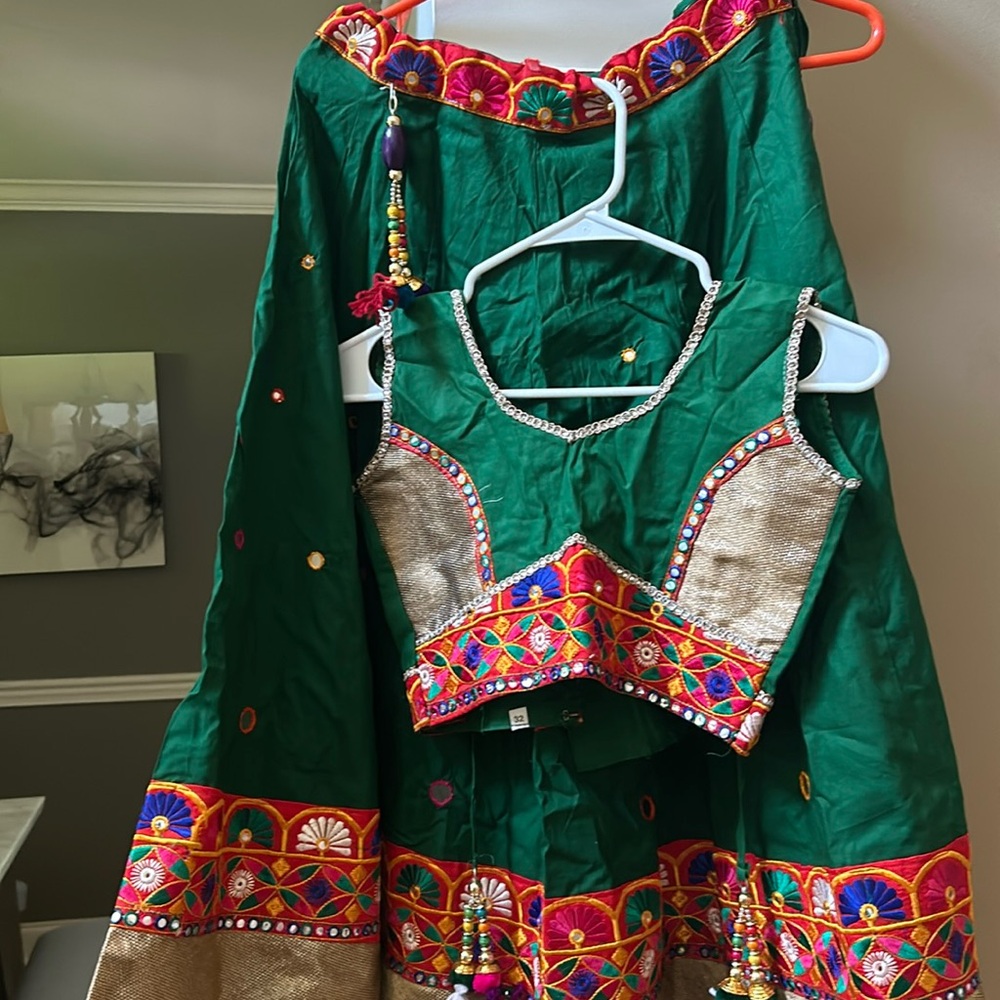 Dark green chaniya with matching blouse very pretty